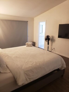Relax in comfort with a large bed and flat-screen TV.
