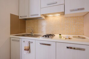 Fridge, stovetop, coffee/tea maker, cookware/dishes/utensils