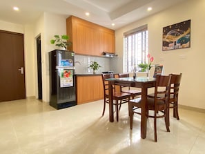 Basic Apartment | Private kitchen | Fridge, stovetop