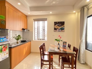 Basic Apartment | Private kitchen | Fridge, stovetop