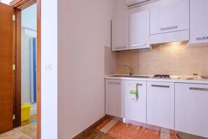 Fridge, stovetop, coffee/tea maker, cookware/dishes/utensils