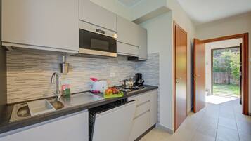 Family House, Multiple Bedrooms, 2 Bathrooms, Mountainside (Cottage del Lago) | Private kitchen | Fridge, microwave, stovetop, dishwasher