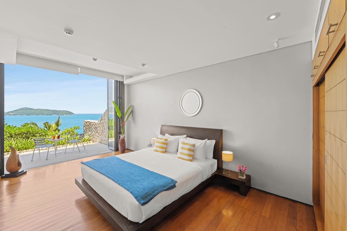 Desk, iron/ironing board, bed sheets