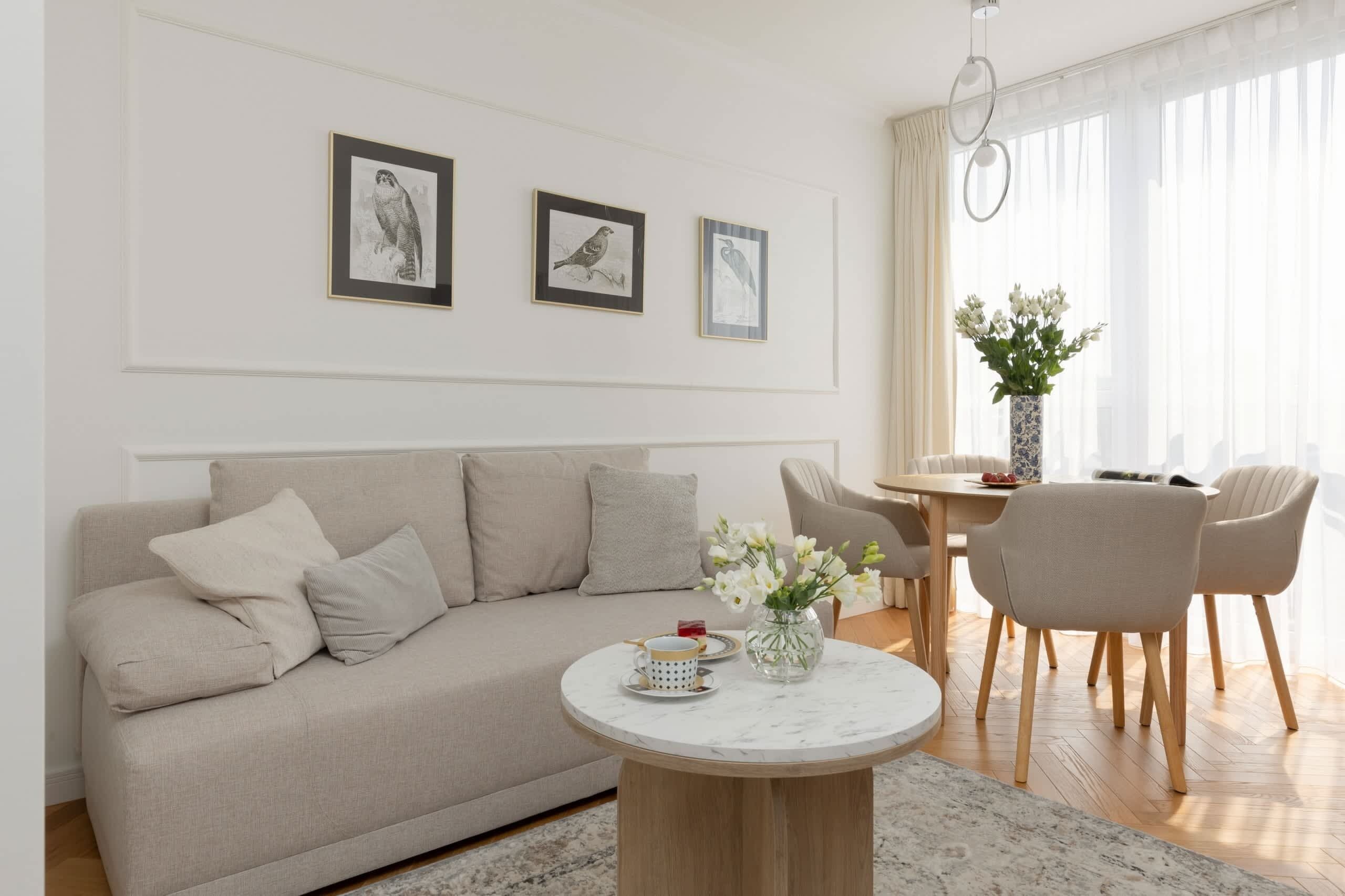 Relax in the stylish living room with a comfortable sofa and modern decor.