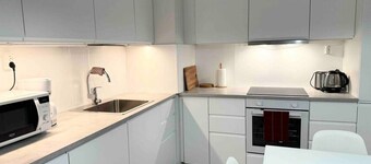 #PIHLAJISTO · Spacious 4-bedroom condo with patio, free parking