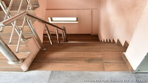 A staircase with metal railings and wooden steps. - Great View Hotel And Restaurant (Tehri)
