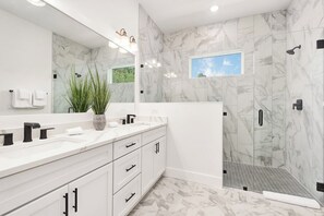Bathtub, hair dryer, towels, toilet paper