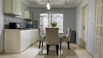 Superior Suite | Private kitchen | Fridge, microwave, stovetop, electric kettle