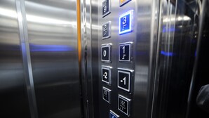 An elevator control panel with buttons labeled 0 to 3, and a blue emergency button. - Hotel Verisima (Tbilisi)