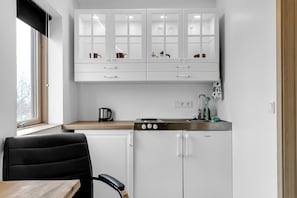 Standard Apartment | Private kitchen | Fridge, stovetop, electric kettle, cleaning supplies