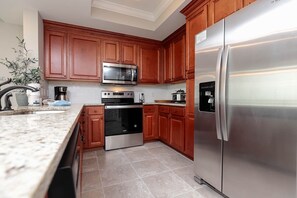 Condo, 2 Bedrooms | Private kitchen | Fridge, oven, coffee/tea maker