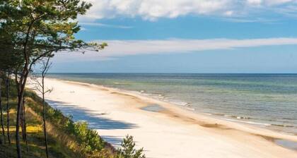 Appartement sur la Dziwna avec spa et piscine