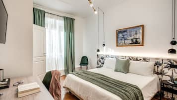 Camera Classic con letto matrimoniale o 2 letti singoli | Copriletto in piuma, minibar (con alcuni snack e alcune bevande gratis)