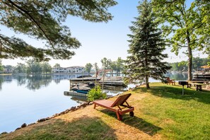 Enjoy a serene lakeside retreat with a clear view of the calm lake and access to the water's edge.