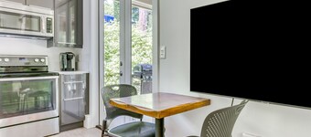 Dog-friendly studio with river view, patio, grill, & shared W/D