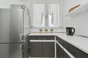 Apartment, 1 Bedroom, Balcony | Private kitchen | Microwave, cookware/dishes/utensils - Cozy Swobodna by Renters (Wroclaw)