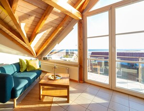 Living area - In der Wohnung Kokosnuss Erwartet Sie ein Gigantischer Ausblick Über den Nationalpark Wattenmeer! Öffnen Sie Ihre Balkontür, Holen Sie Einmal Tief Luft und Atmen Sie Entspannung pur ein (Wittdün auf Amrum)