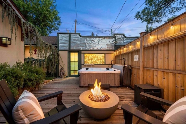 - Outdoor patio with fire pit and cozy lounge chairs - hot tub under glowing evening lights - Airbnb retreat for relaxing nights and memorable moments