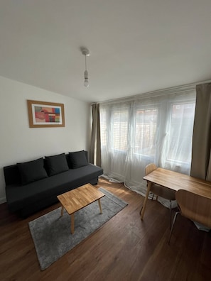 Basic Apartment, Multiple Beds | Living area | TV