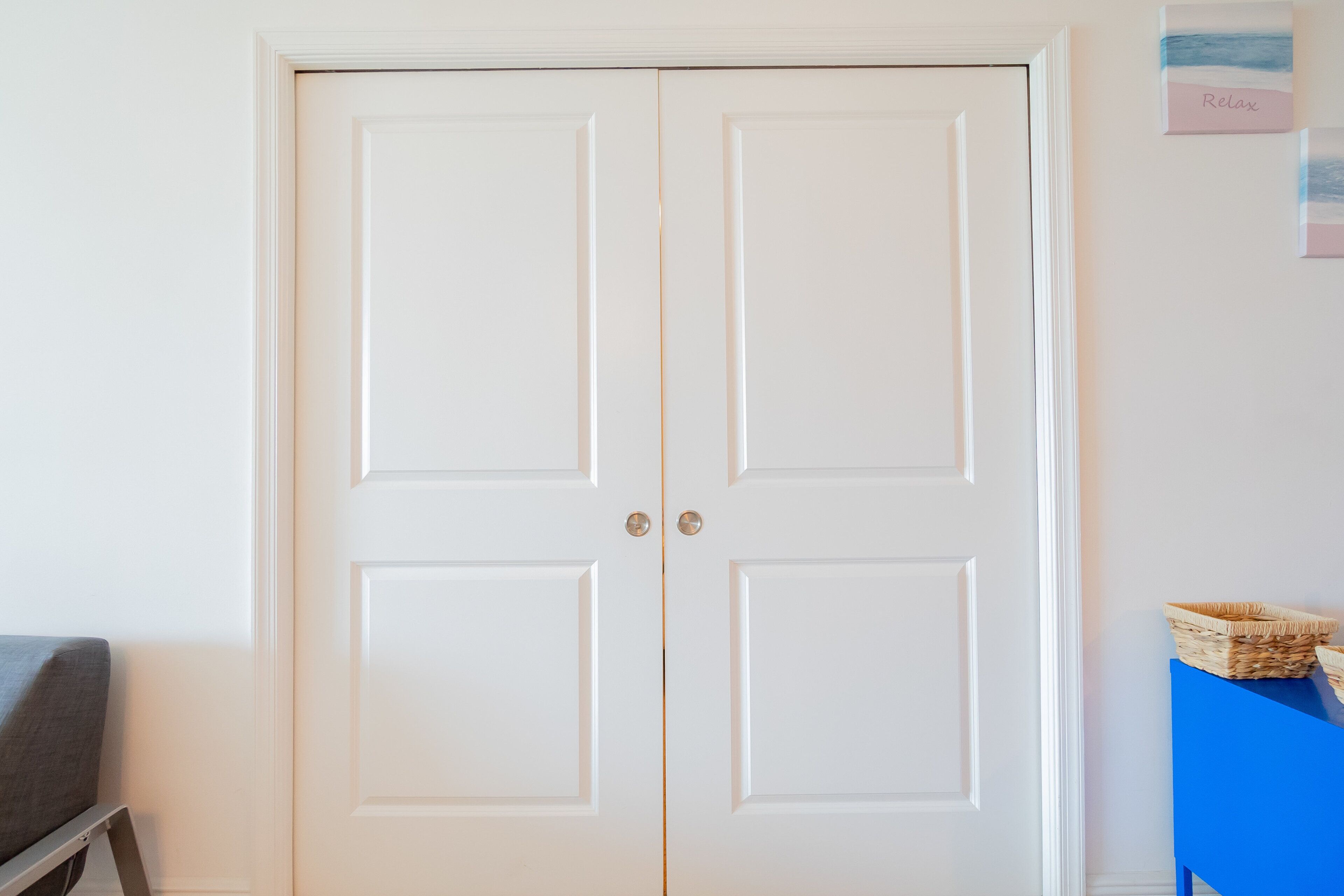A white double door with a small gap in the center.