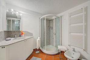 Separate bathtub and shower, bidet, towels, soap
