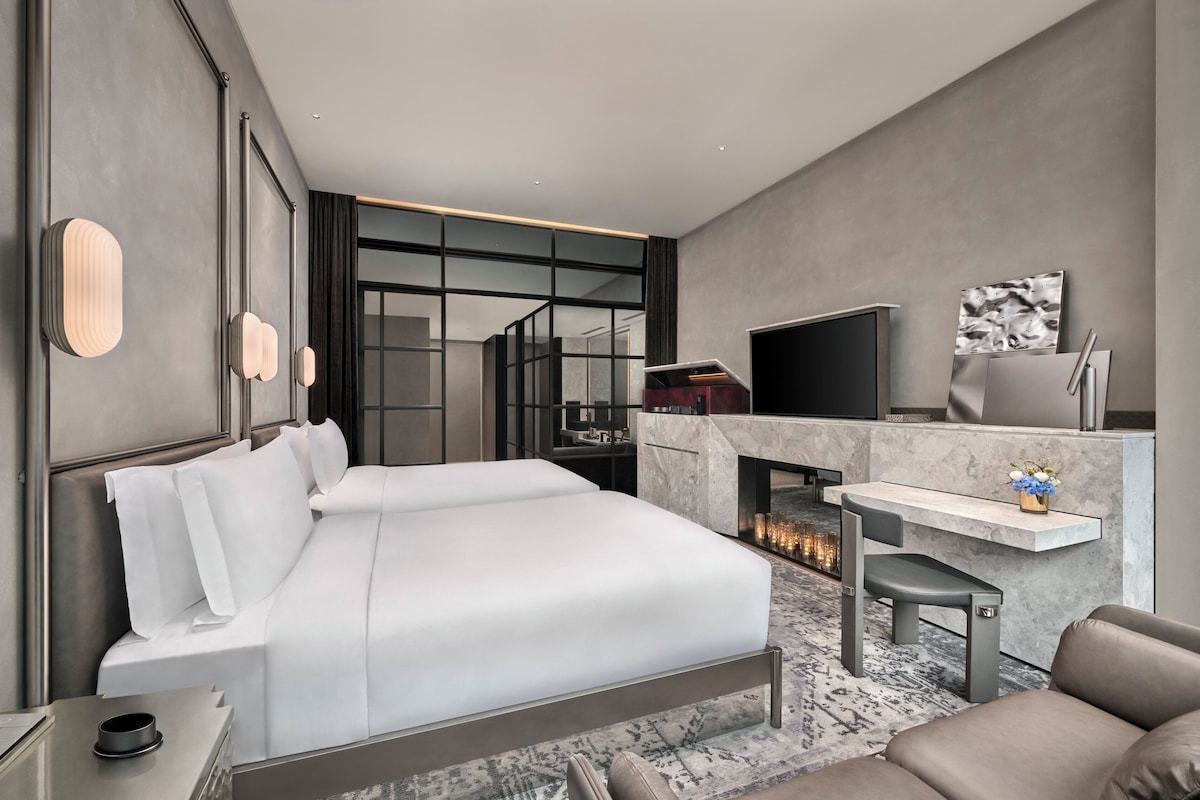 Premium bedding, down comforters, memory foam beds, minibar (free items)