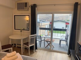 Deluxe Suite, 2 Queen Beds, Kitchen | Living area | 55-inch LED TV with digital channels, TV, streaming services