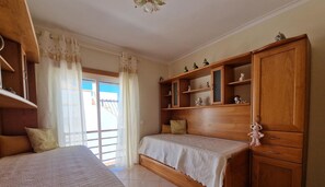 Experience a classic retreat with a double bed, wooden wardrobe, and a window offering a view of the outside.