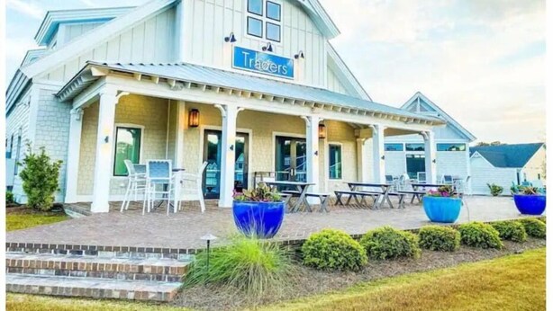 A building with a sign reading "Travelers". - A Block from the Dock in Beau Coast Classic (Beaufort)