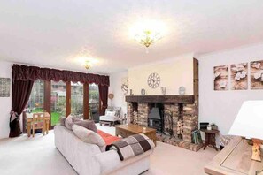 House, Multiple Beds | Living area | Fireplace