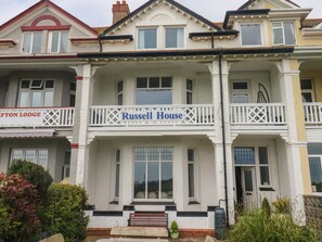 A two-story building with a balcony labeled "Russell House". - Russell House (Paignton)