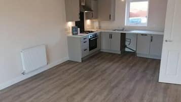 Apartment, 1 Queen Bed | Private kitchen | Fridge, microwave, oven, stovetop