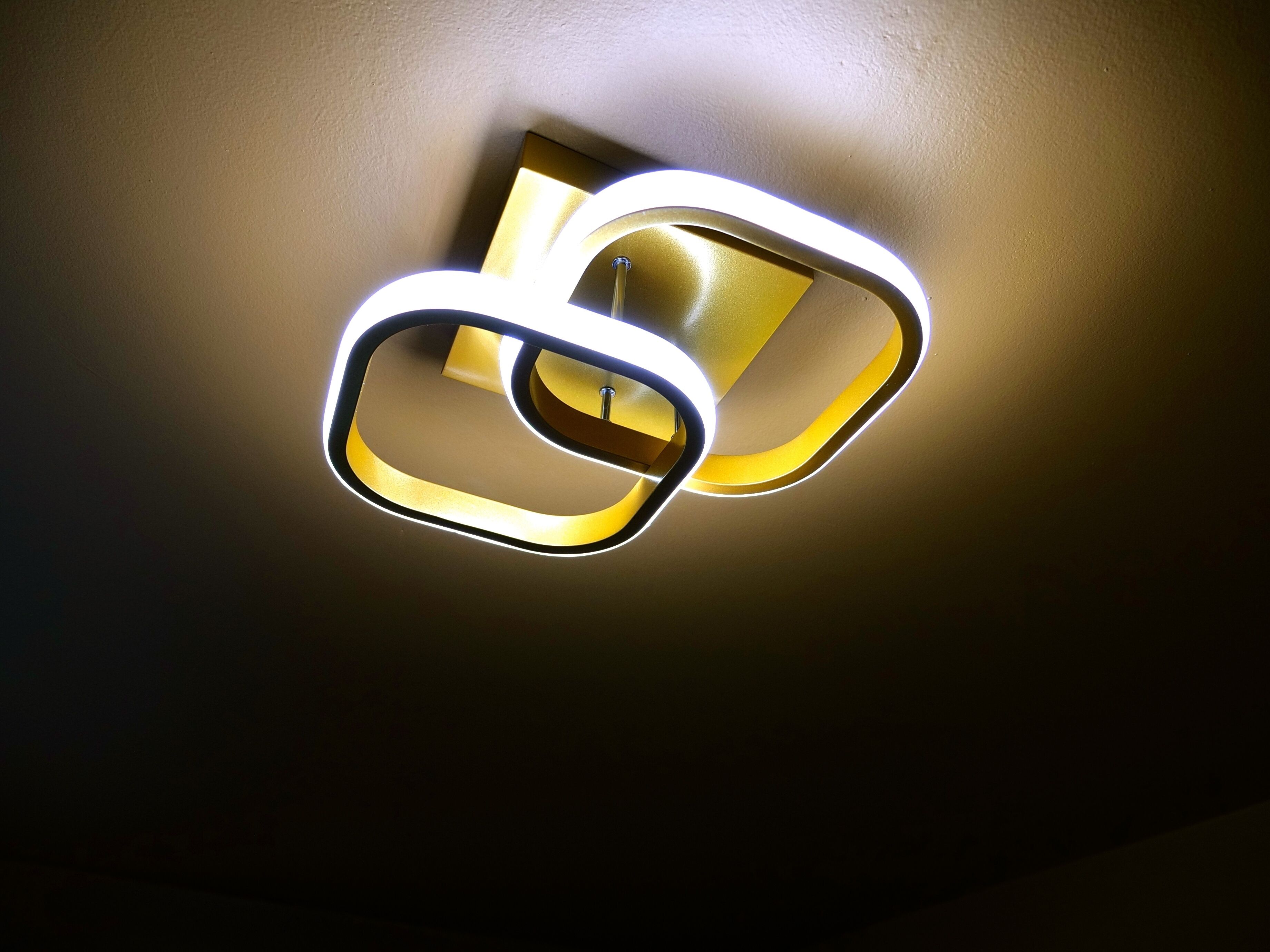 A modern light fixture with a geometric design.