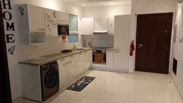 Apartment | Private kitchen | Fridge, microwave, oven, stovetop