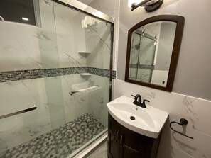 Shower, hair dryer, towels, soap