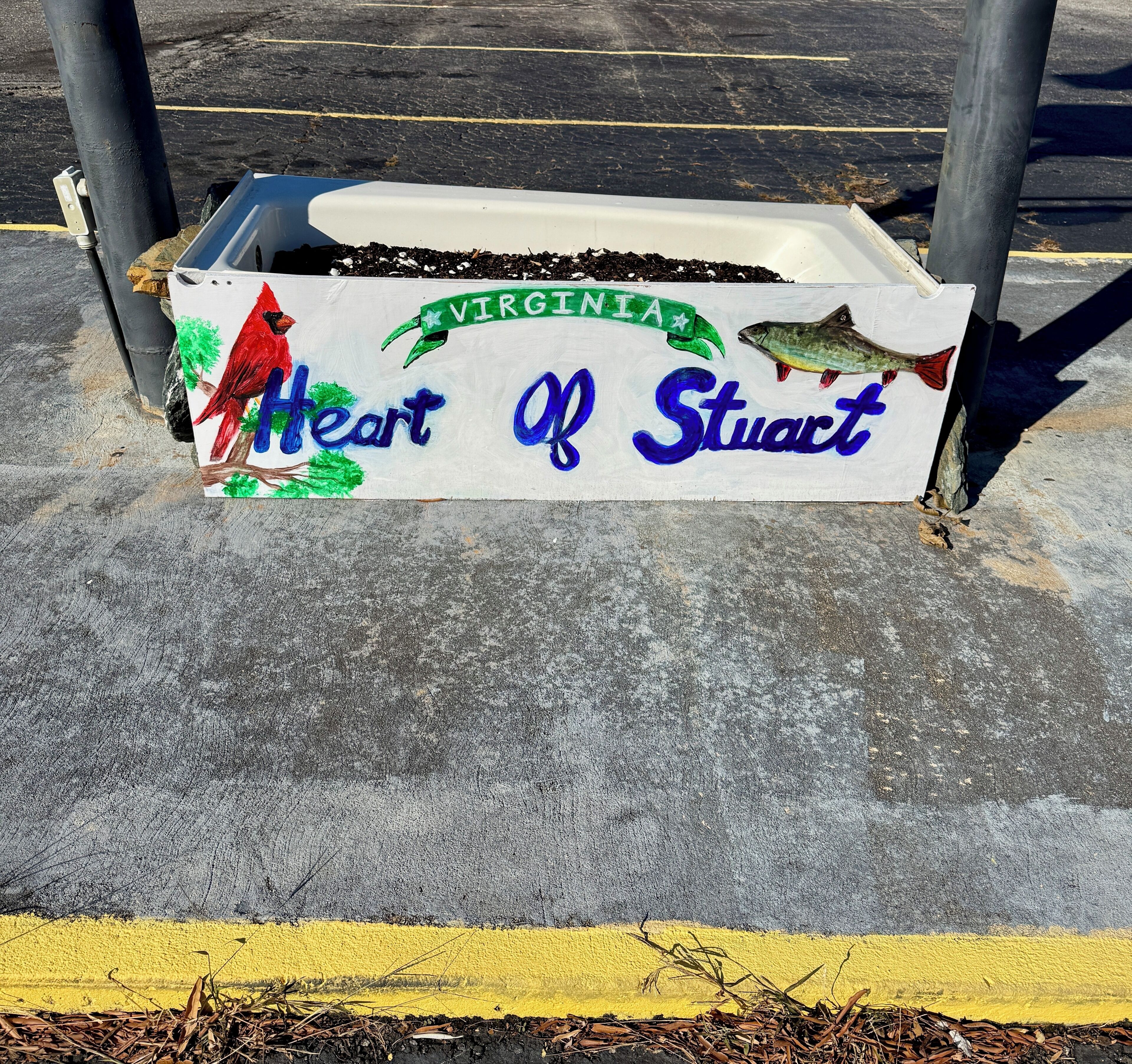 A planter box with a sign that reads "Heart of Stuart" and "Virginia."