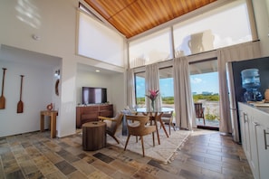 Deluxe Villa, 1 Queen Bed, Garden View (Cakora Garden View 1 Bedroom Loft Vil) | Living area | 42-inch Smart TV with cable channels - Aruna Resort & Villas (San Pedro)