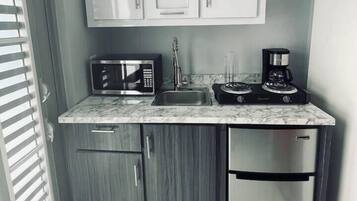Fridge, microwave, stovetop, coffee/tea maker