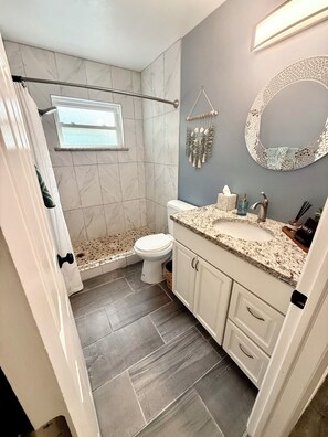 Shower, hair dryer, towels, soap