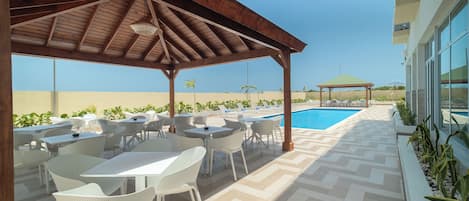 Outdoor pool, open 10:00 AM to 6:00 PM, sun loungers