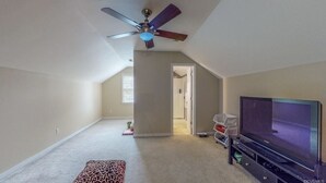 A spacious living room with a ceiling fan, a flat-screen TV, and a carpeted floor. - Private bedroom and bath!  (Midlothian)