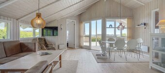 Holiday home with sauna, hot tub and sea view