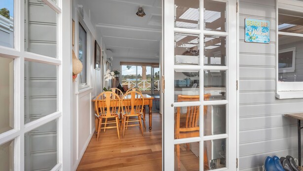 A beach bar sign, wooden chairs, and a dining area with a view. - Mandalay on Pipeclay - 3 Bedroom House - Free Parking - Free WIFI (Cremorne)