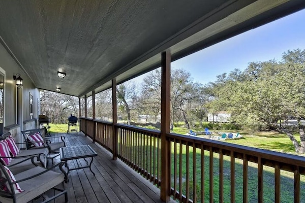 Covered deck overlooking the front yard.