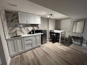 Fridge, microwave, stovetop, coffee/tea maker