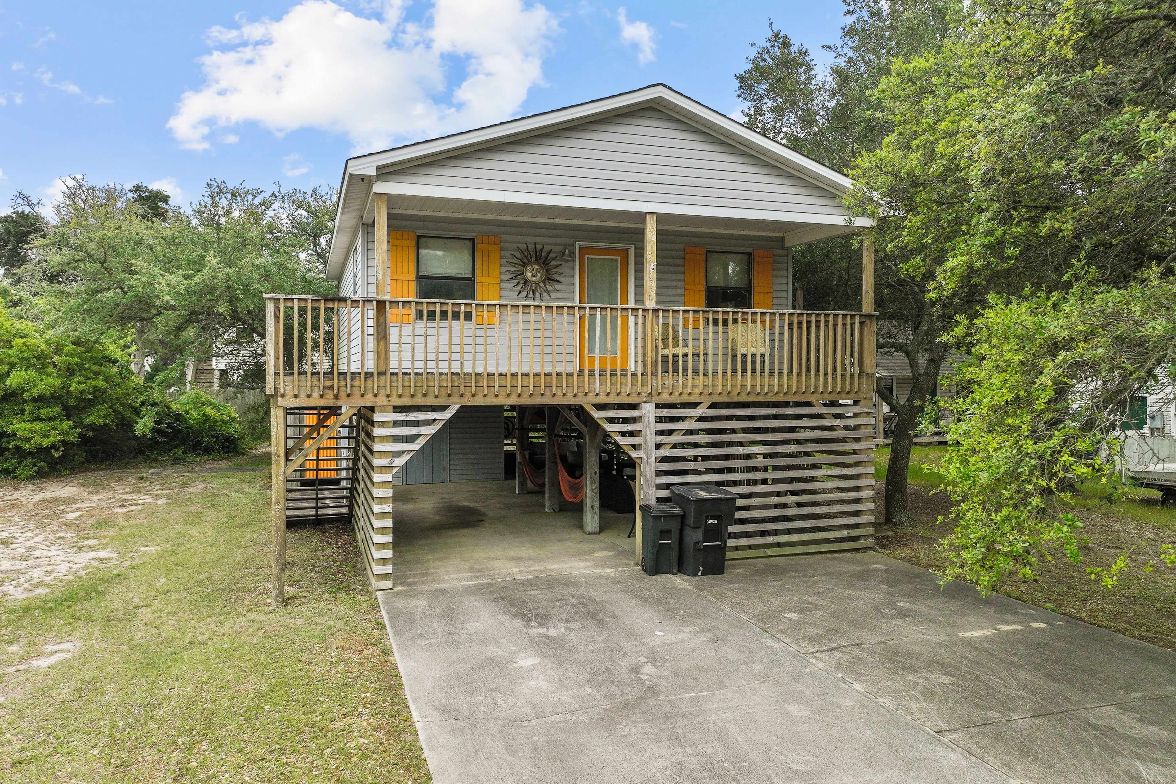 Unique beach home with balcony, hammock, full kitchen, central AC, & W/D
