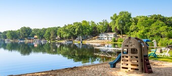 Inviting lakefront condo - amazing views, beach access, fireplace, dock, AC, W/D