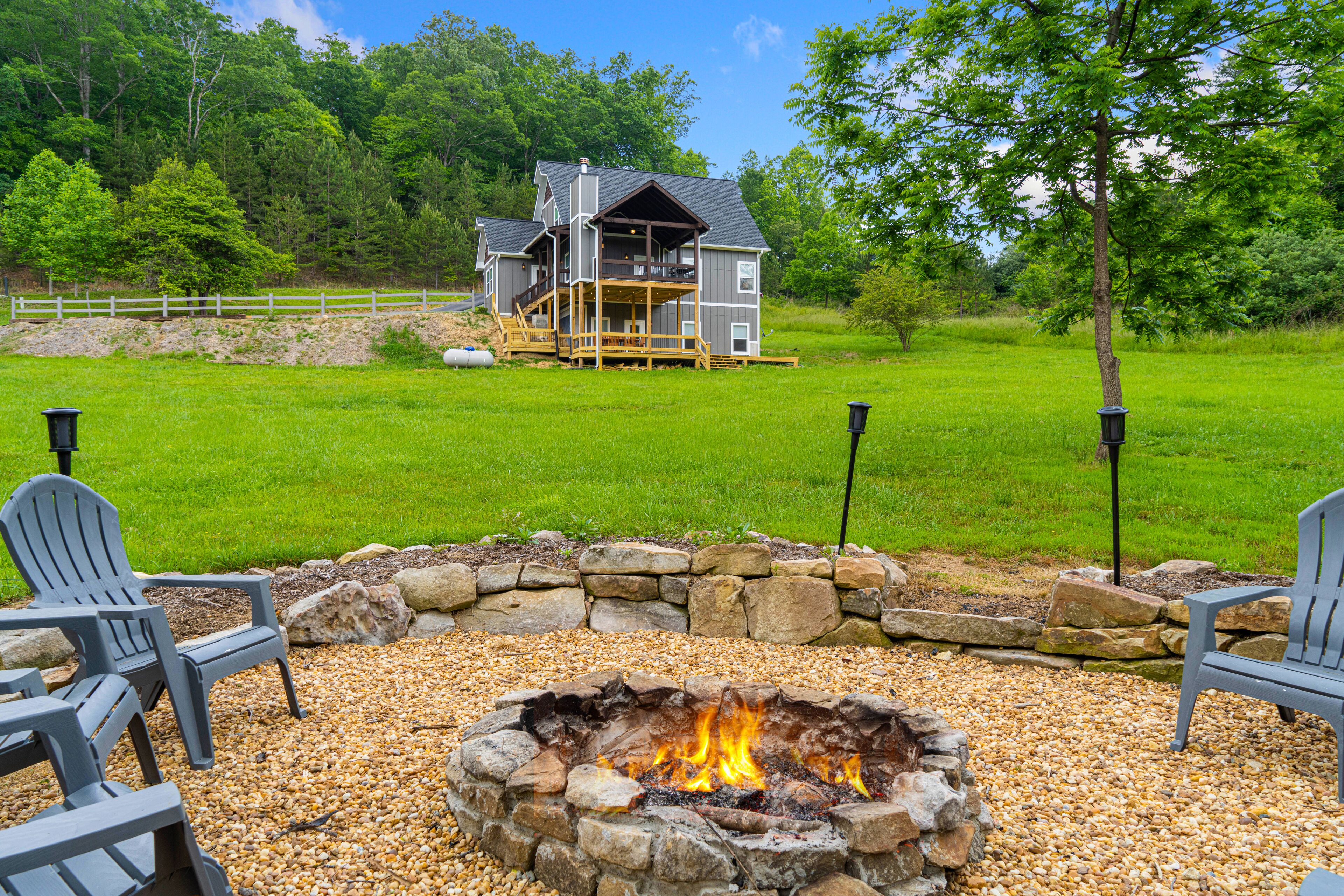 All-new creekside home in a gated community with spacious decks, yard, & firepit