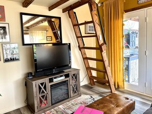 Smart TV, fireplace, books