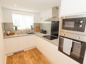 Cottage | Private kitchen | Fridge, electric kettle, toaster, cookware/dishes/utensils - Sea View Terrace (Conwy)